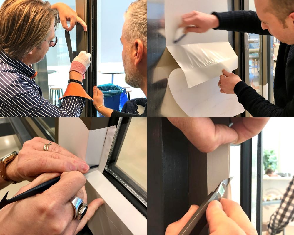 Mensen doen verscheidene praktijkoefeningen met kozijnfolie tijdens “Schilderen met folie” Facadefilm workshop
