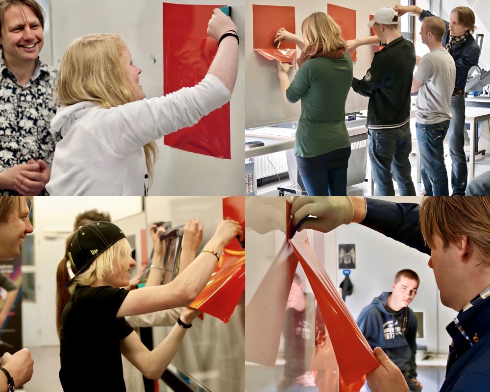 Studenten middelbaar beroepsonderwijs doen praktijkoefeningen tijdens Appcademy workshop en gastcollege op ROC / MBO opleiding signmaker